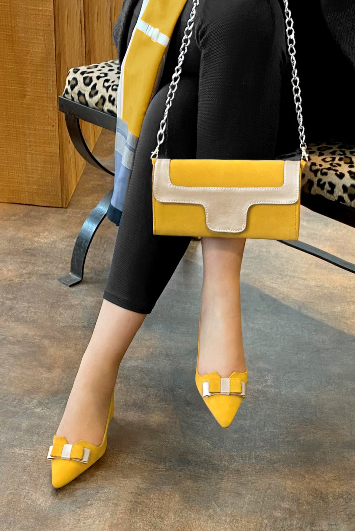 Yellow and gold women's open back shoes, with a knot. Tapered toe. Medium spool heels. Worn view - Florence KOOIJMAN